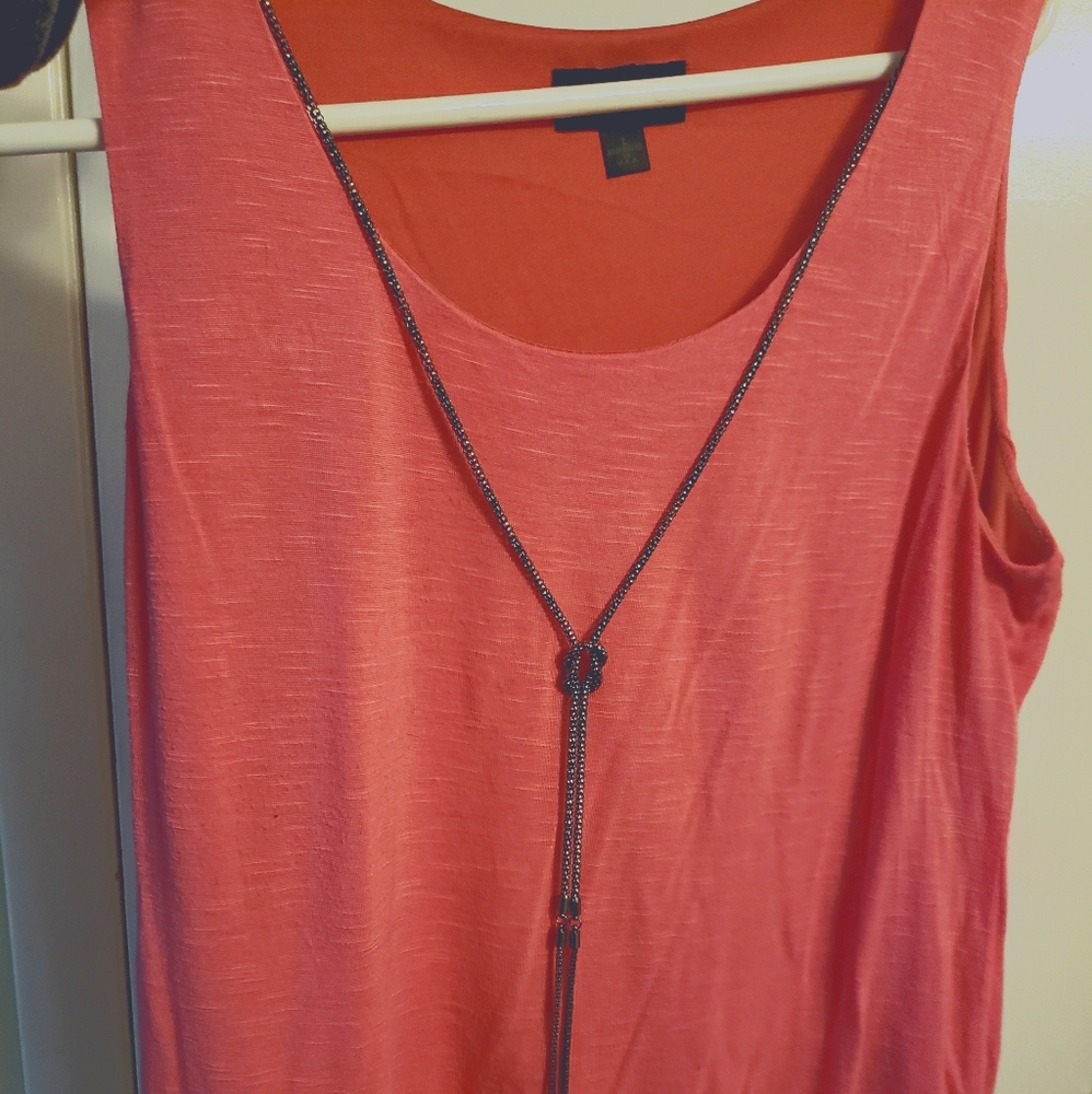 Sleeveless top with built in accessory